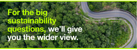 Aerial shot of a road and trees with sustainability text