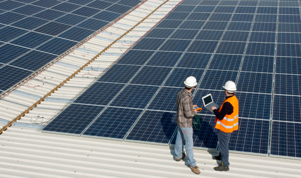 Solar Developers, Operators and EPCs, Two solar operators assessing solar panels