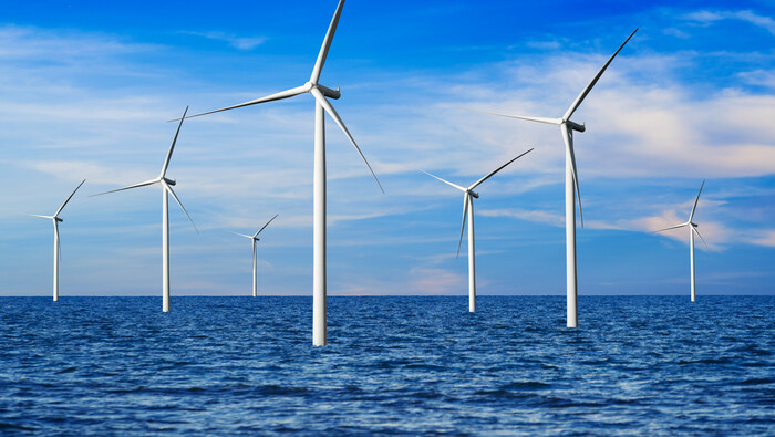 Wind turbines in ocean landscape