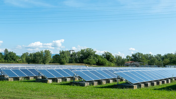 Rows of solar panels on a field.