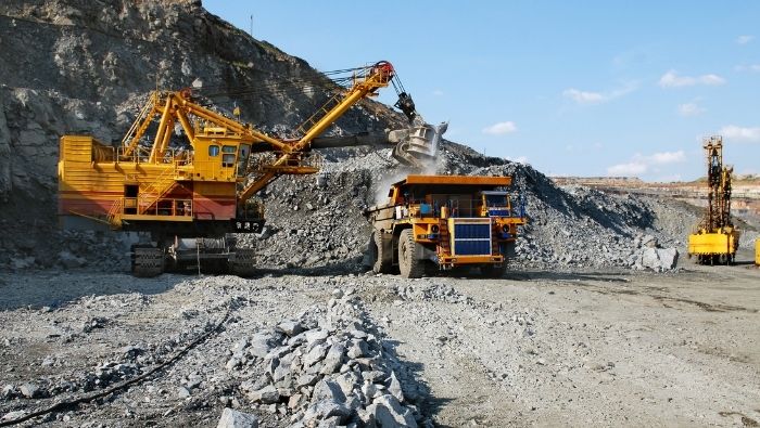 Trucks loading ores in a mining site
